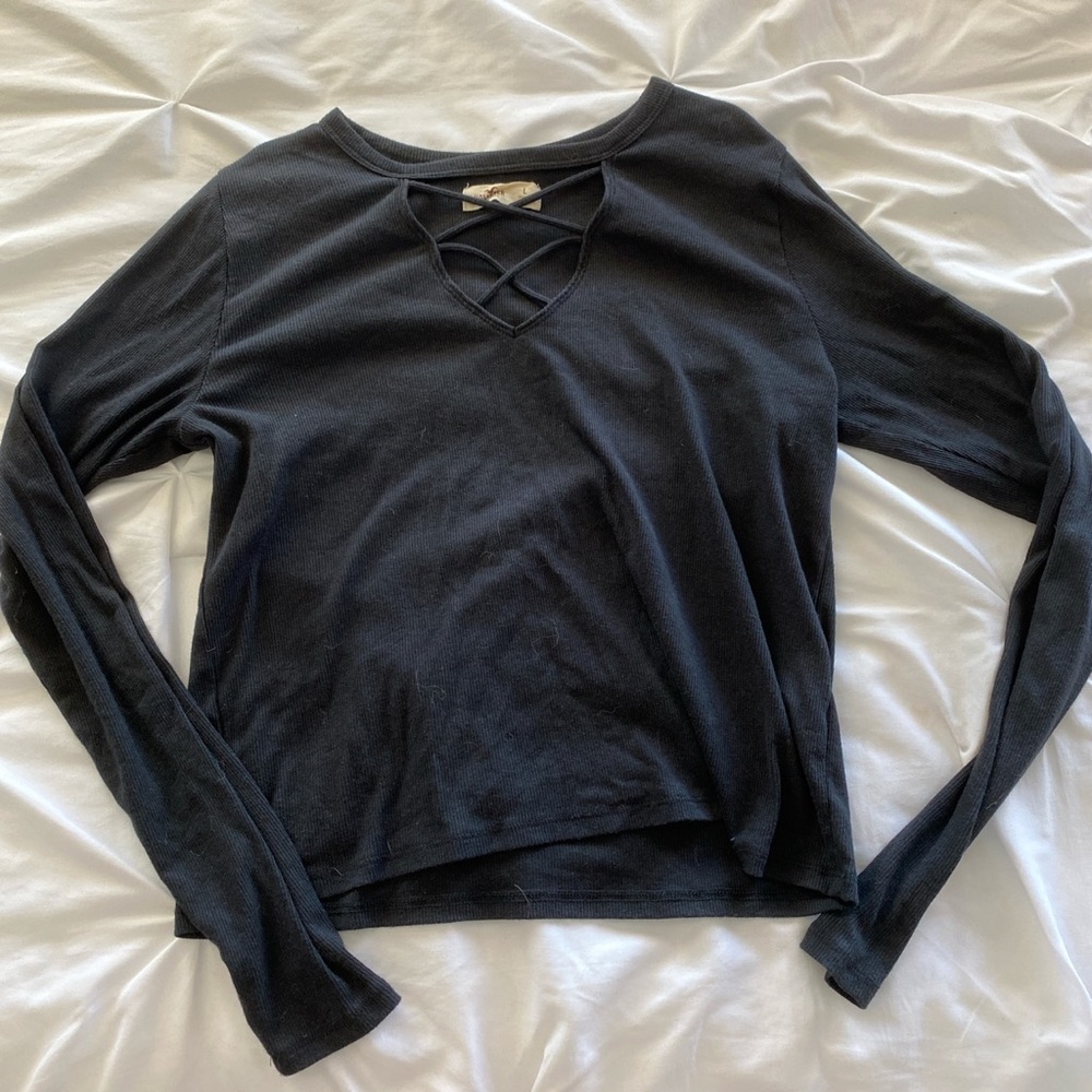 long sleeve black top with straps in the front